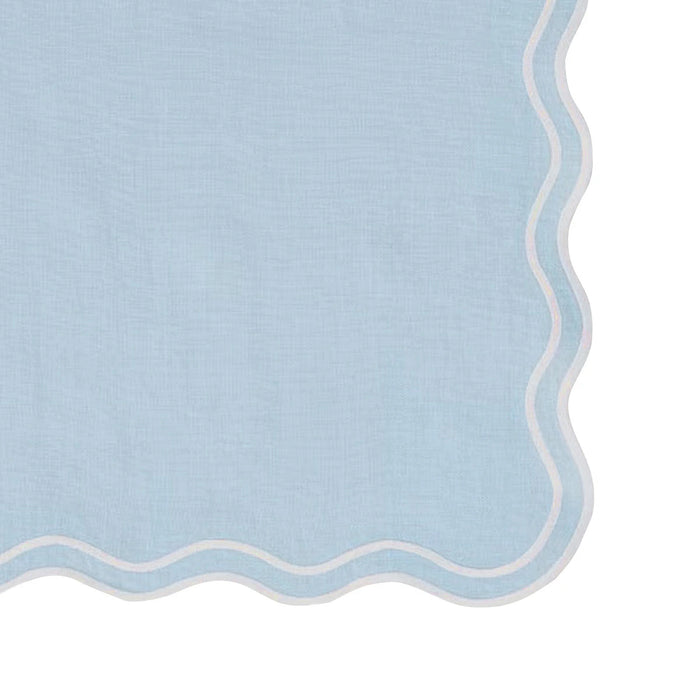 Set of 12 blue scallop edge cloth napkins folded neatly