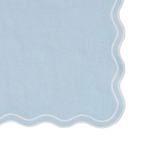 Set of 12 blue scallop edge cloth napkins folded neatly