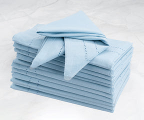 Blue cloth napkins folded on a chic marble countertop