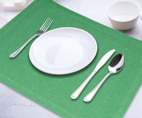 Add a touch of elegance to your table with these striking green placemats, offering both style and protection.