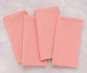 100% cotton light pink napkins stacked and ready for dining use.