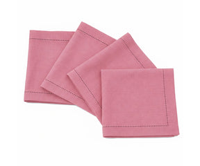 Set of pink napkins with hemmed edges on a white background