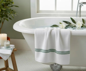 Premium striped bath towel in white with green embroidery, breathable and luxurious, available in multiple sizes for a spa-like experience at home.