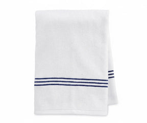 High-quality white bath towel with navy stripe detailing, crafted from durable and absorbent 100% cotton for lasting softness and superior comfort.
