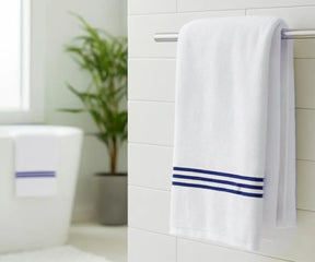 Luxury navy blue and white striped bath towel made from 100% premium cotton, featuring elegant navy embroidery for a soft, absorbent, and spa-quality experience at home.