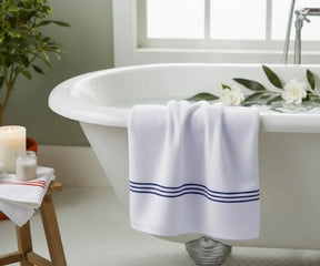 Elegant striped bath towel in crisp white with navy embroidery, breathable and luxurious, ideal for home, spa, or gym use — available in multiple sizes.