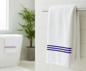 Luxury royal blue and white striped bath towel made from 100% premium cotton, featuring elegant royal blue embroidery — ultra-soft, absorbent, and perfect for home, spa, or gym use.