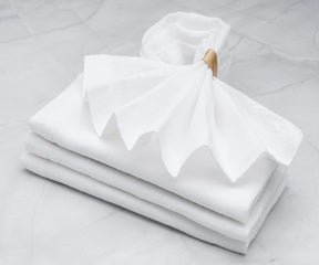 White dinner napkins  Linen has excellent absorbent properties, making it effective at wiping up spills and messes during meals. 