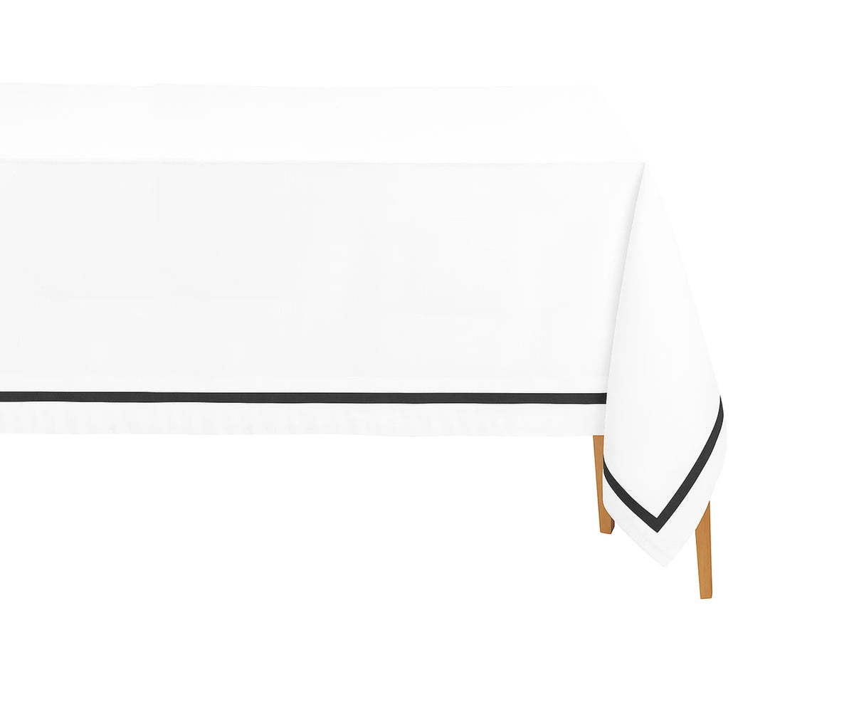 Black satin rectangle cotton tablecloth on a dining table with black and white napkins