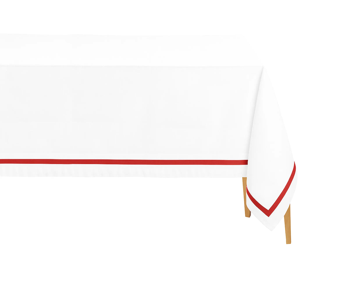 Red satin border rectangle cotton tablecloth on a dining table with white dinnerware