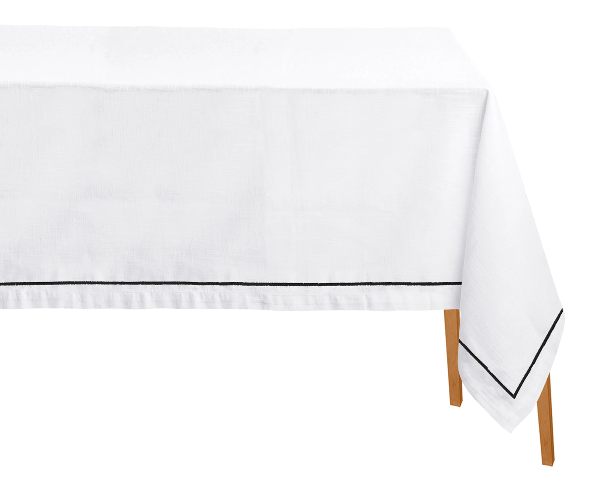Black embroidered tablecloth with intricate gold embroidery, showcasing timeless elegance and craftsmanship