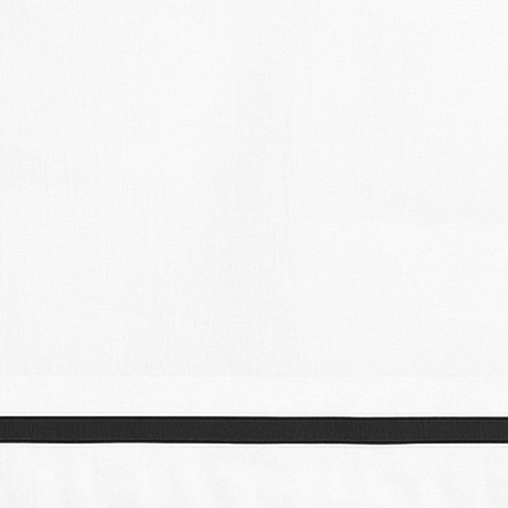 Close-up detail of white cotton pillowcase with a black border line.