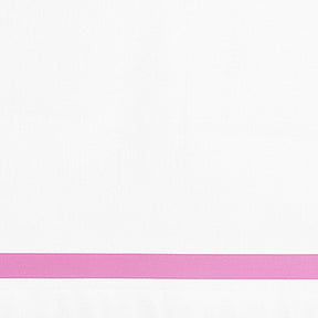 Close-up detail of white cotton pillowcase with a pink border line.