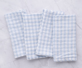 Set of four linen napkins with blue and white gingham pattern