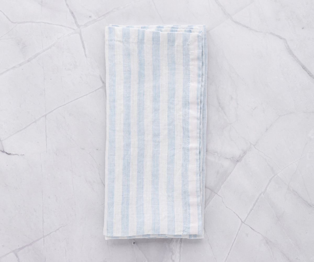 Marine Blue Linen Napkin Terra: Channel coastal vibes with our Marine Blue Linen Napkin featuring Terra accents, bringing a touch of the sea to your table.