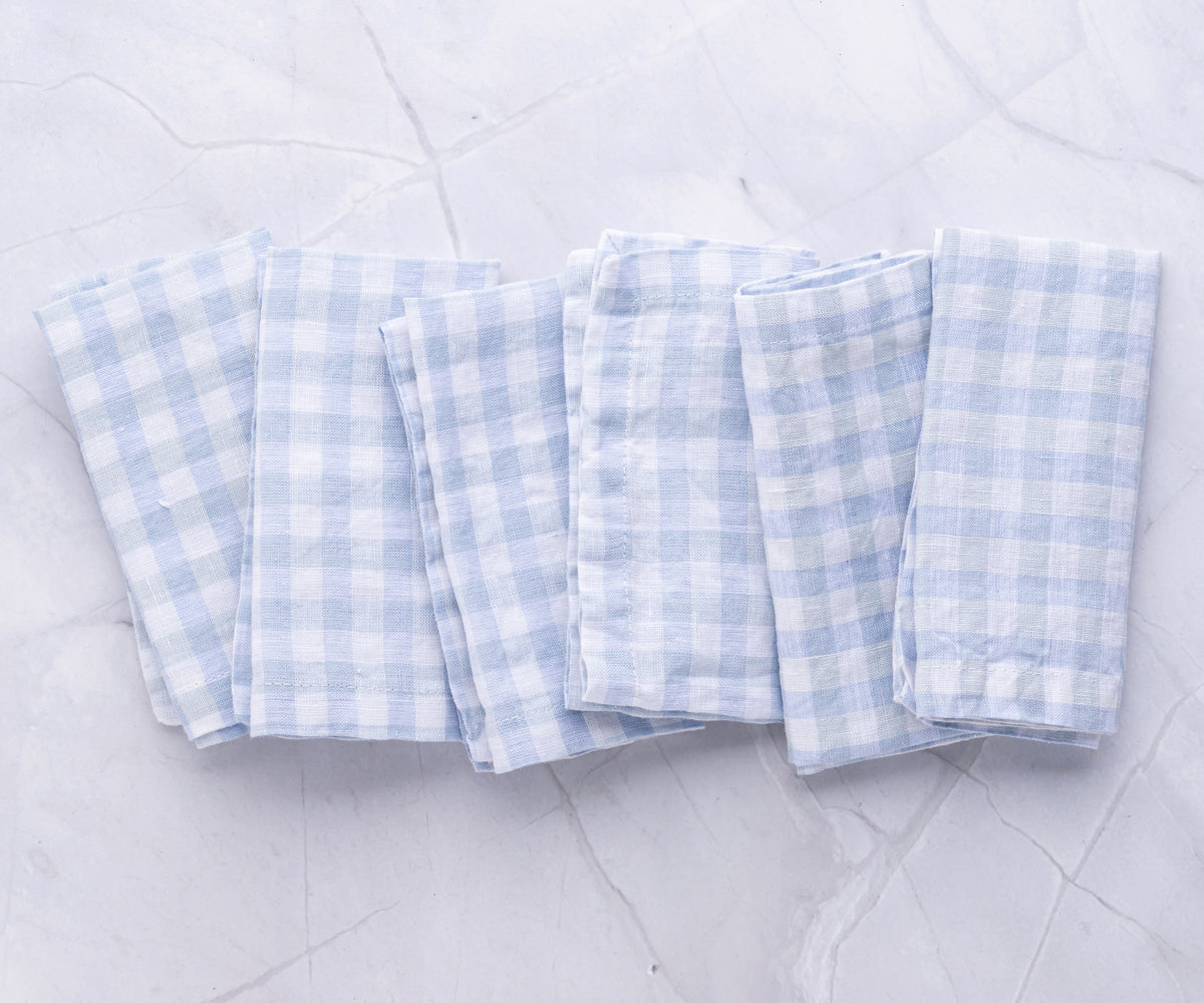 Set of four linen napkins with blue and white gingham pattern