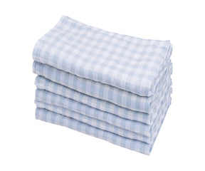 Neat stack of blue and white gingham linen napkins