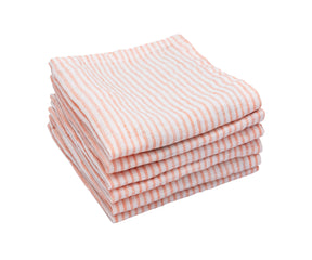 Pink and white linen striped napkins stacked on a neutral surface