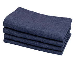 Navy blue and linen cloth napkins, a chic combination, bring sophistication to your dining arrangement.
