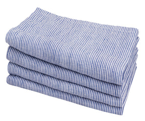 Multiple blue and white striped linen napkins in a symmetrical stack