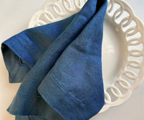 Folded linen napkins, blue color