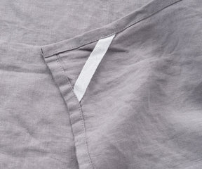 Soft gray kitchen towel with waffle texture on wooden table