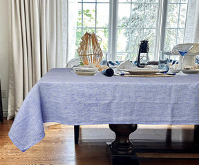 Blue and white stripe tablecloth offering a classic and timeless look.