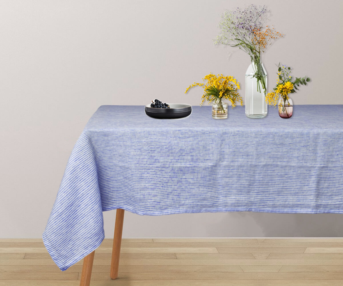 Blue and white striped tablecloth for a cheerful and inviting atmosphere.