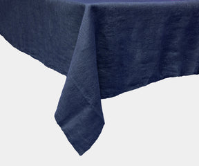 Blue linen tablecloth for a neutral and warm table setting.