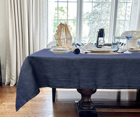 A rectangular tablecloth in classic linen material. Elegant blue tablecloth for a vibrant table setting.