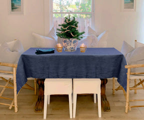 Navy linen tablecloths adding warmth and richness to your dining experience.