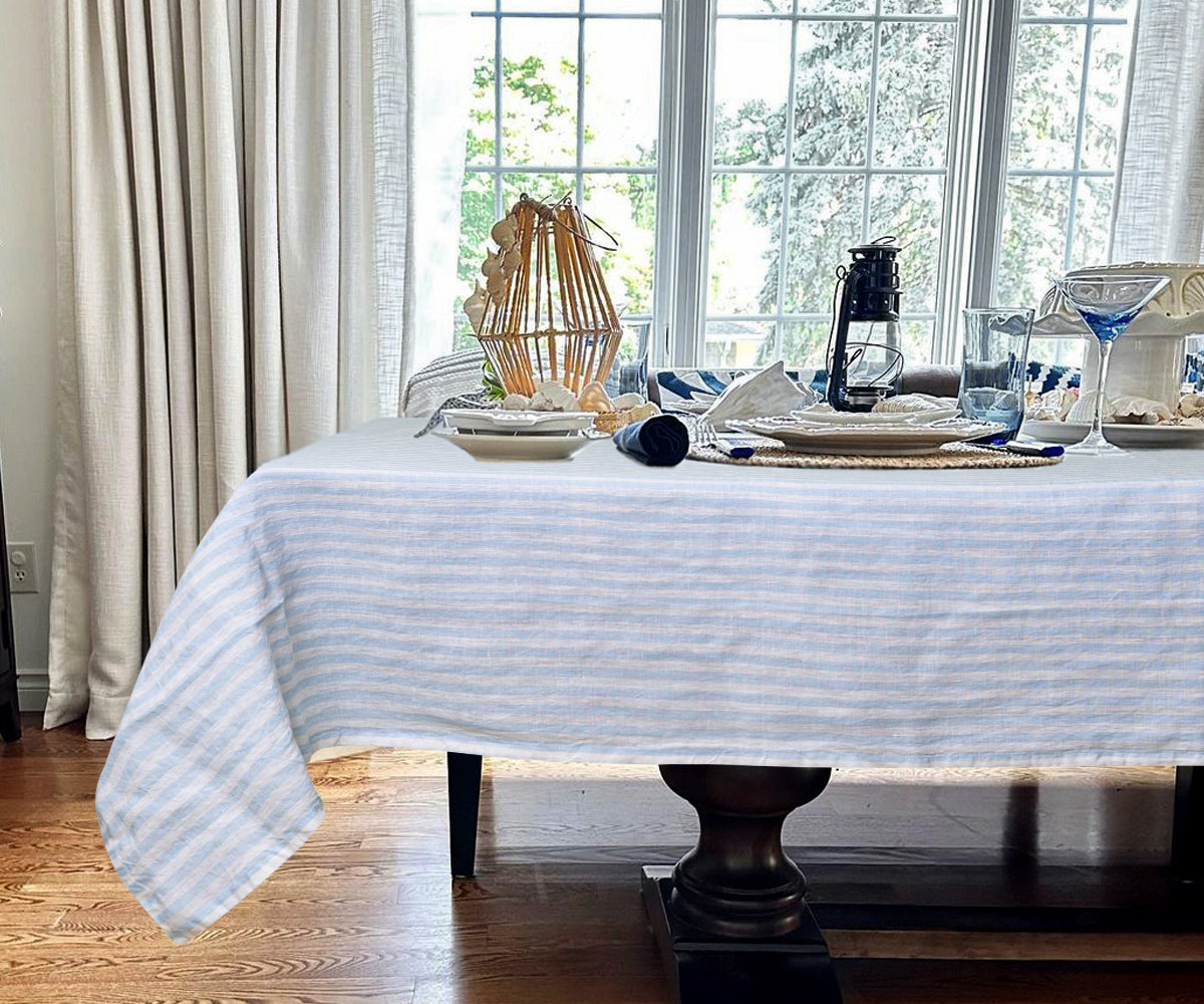 Striped linen tablecloth with a subtle pattern for an understated elegance.