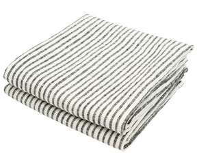 Linen kitchen towel hanging on a hook with black stripe detailing
