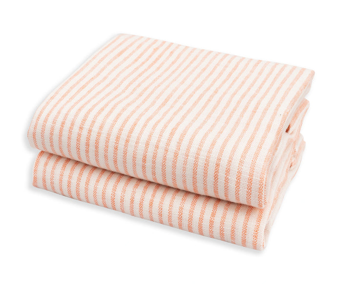 Rust linen striped towel, folded fabric with peach and white linen  stripes on a white background