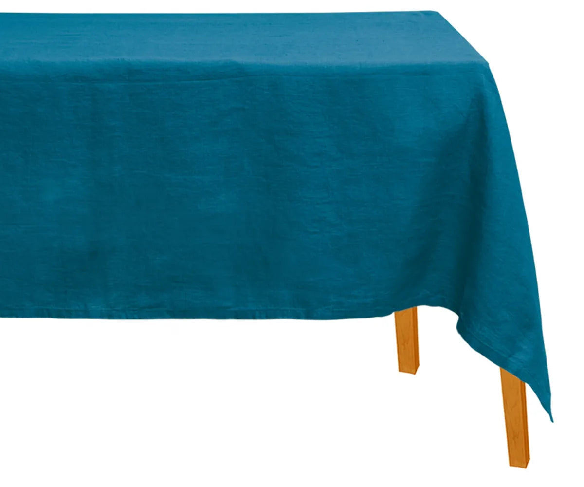 Teal linen tablecloth with a smooth, natural drape covering a dining table, offering a refined look with durable texture that enhances everyday dining and special gatherings.