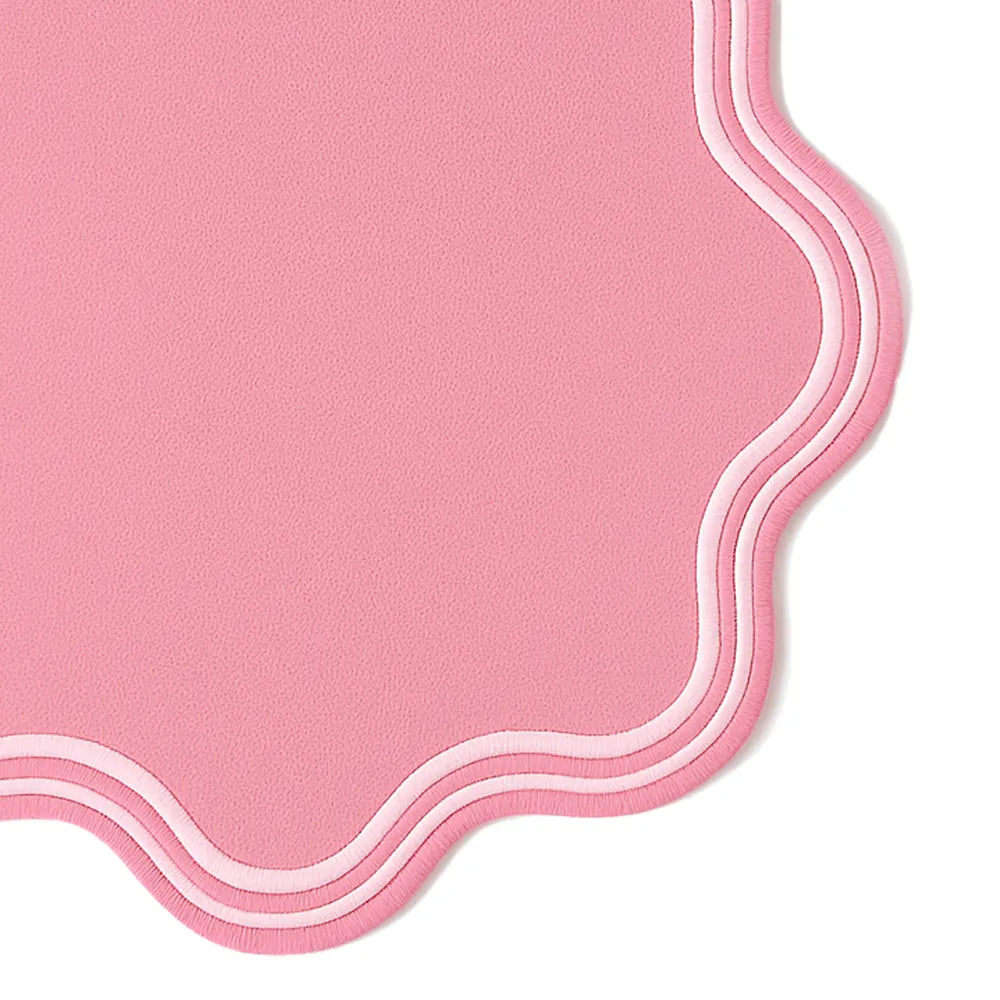 Elegant pink scalloped placemats, crafted from durable cotton – washable round table décor offered in multiple sets for home and event styling.