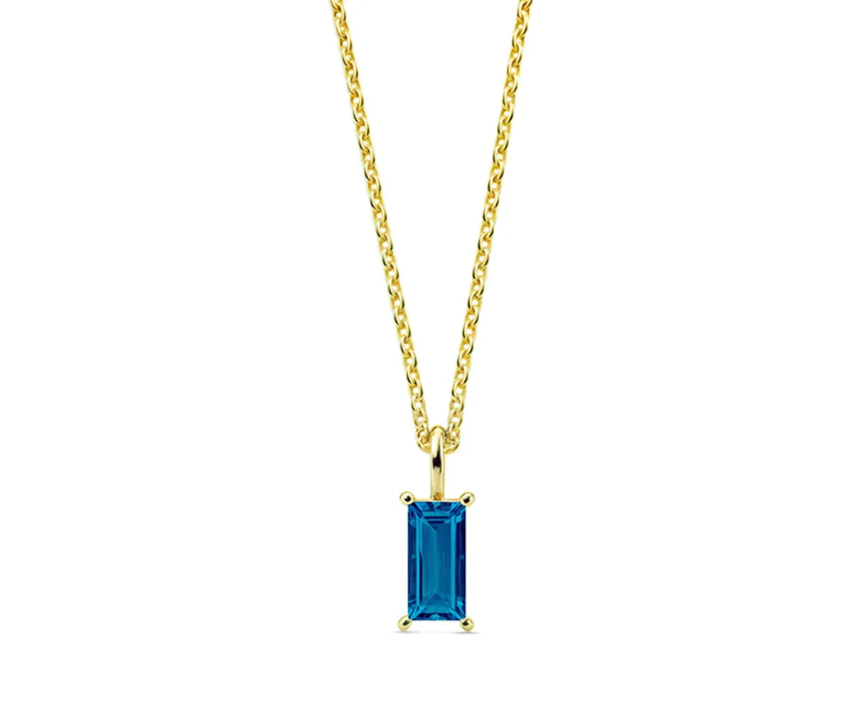 Close-up of aquamarine pendant necklace with 14K yellow gold plating