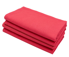 Set of maroon cloth napkins arranged beautifully for a festive dinner setting.