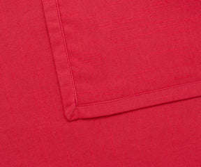Premium maroon dinner napkin displayed with coordinated table décor and glassware.