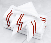 Luxurious linen napkins showcasing a double line of magenta embroidery.