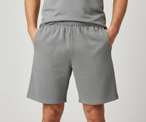 Regular fit men’s grey shorts in soft cotton, featuring elastic waist and drawstring closure for a secure and flexible fit