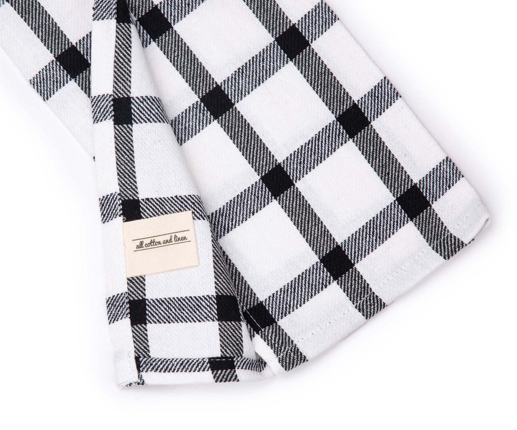 Monochrome checkered dish towel with visible brand label