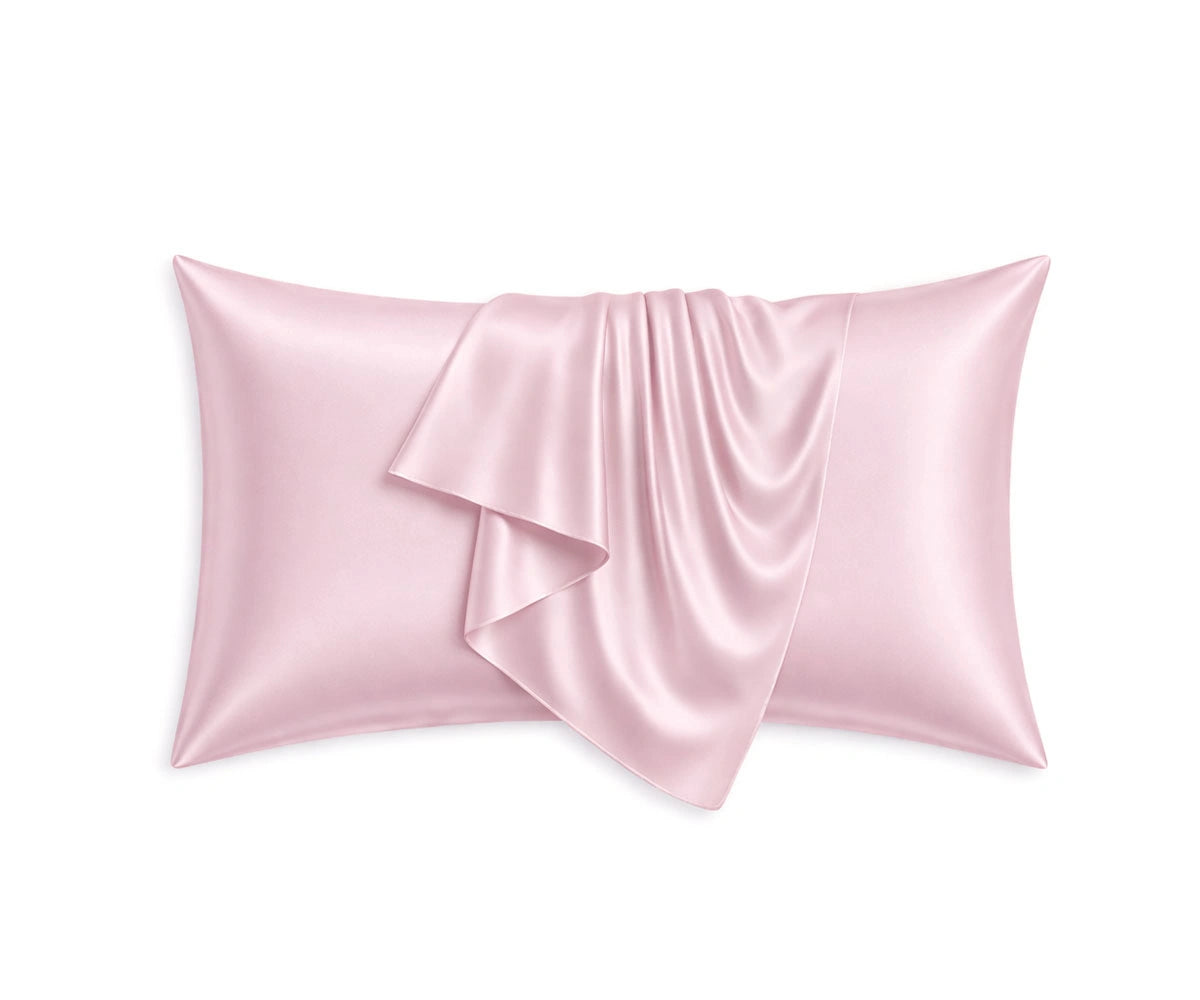 Pastel pink mulberry silk pillowcases with a soft blush shade, designed to reduce hair frizz and enhance beauty sleep comfort.