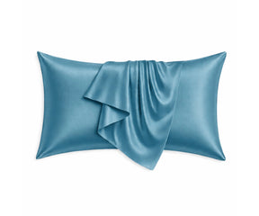 Dusty blue mulberry silk pillowcases with a subtle muted tone, designed for breathable comfort and gentle care for hair and skin.