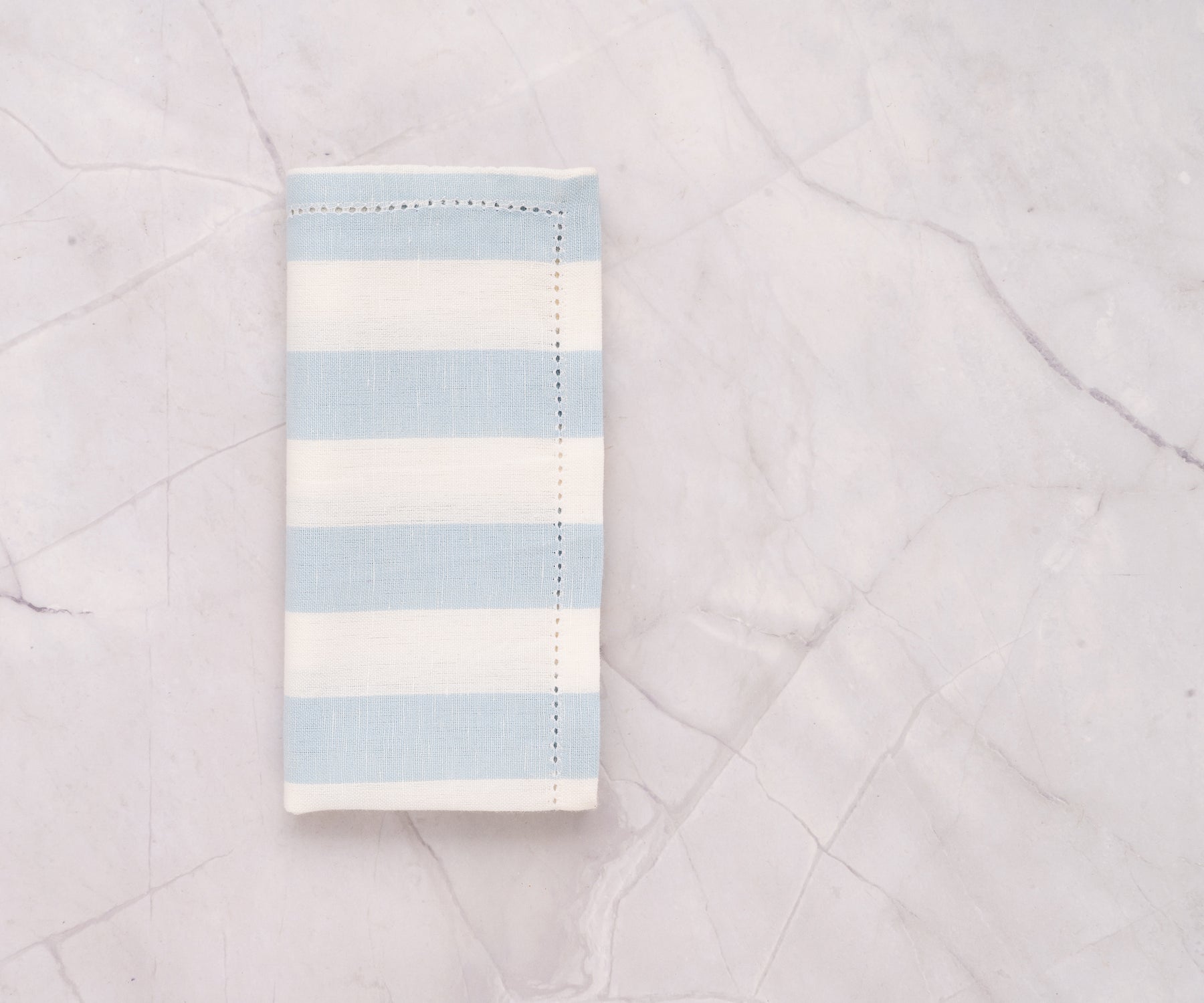 Soft and eco-friendly pale blue cotton napkins with cabana stripe for any occasion.
