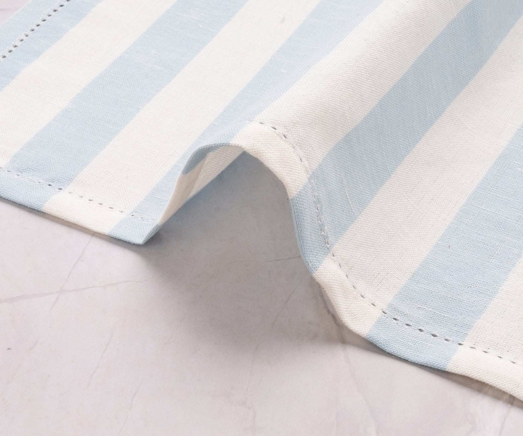 Pale blue cabana stripe napkins, soft texture, ideal for daily meals or special events.
