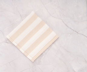 Elegant beige cabana stripe napkins, set of 4, adding charm to any table.

