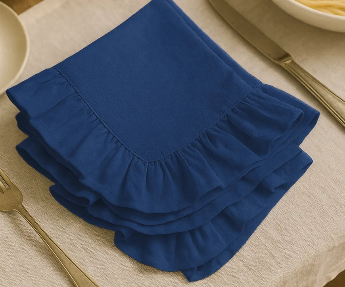 Navy blue cotton ruffle edge dinner napkins, reusable and absorbent cloth napkins for weddings, parties, special celebrations, and everyday dining table décor.