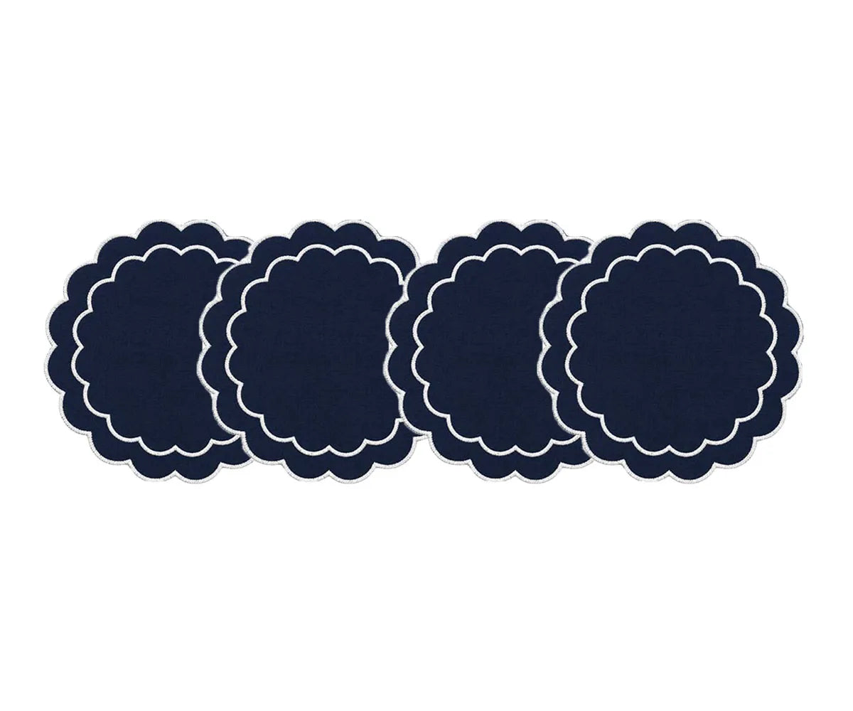 Embroidered round placemats with a scalloped edge for an elegant and inviting tablescape
