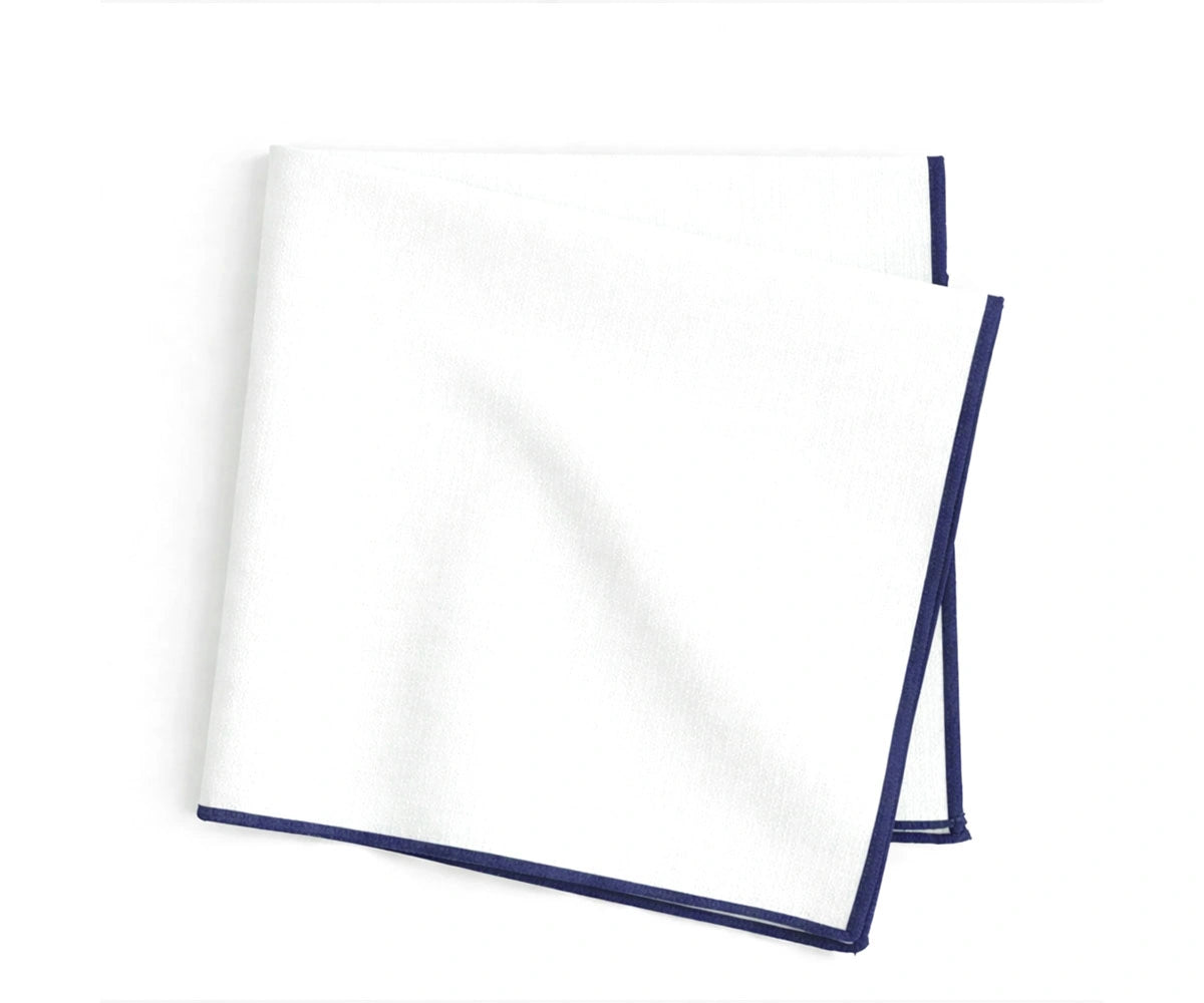 White cotton napkins with navy blue merrow stitched edges, classic embroidered napkins for formal dining